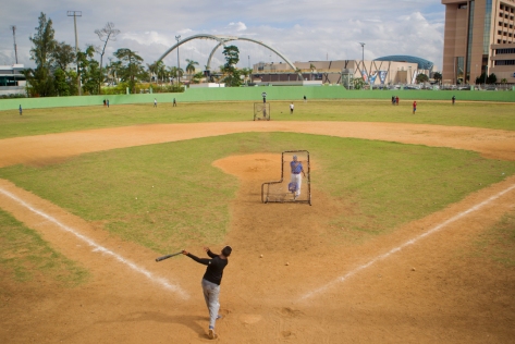 A shortstop takes batting practice at the Centro Olimpico baseball field in Santo Domingo. Photo by Nickolai Hammar